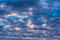 Beautiful clouds in blue sky, illuminated by rays of sun at colorful sunset to change weather. Abstract summer Royalty Free Stock Photo