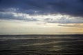 Beautiful clouds float over the sea at sunset on a summer day. Royalty Free Stock Photo