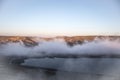 Beautiful clouds flying over the lake near mountains. Evening time shot over the clouds. Baku, Azerbaijan Royalty Free Stock Photo