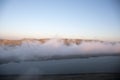 Beautiful clouds flying over the lake near mountains. Evening time shot over the clouds. Baku, Azerbaijan Royalty Free Stock Photo