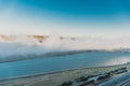 Beautiful clouds flying over the lake near mountains. Evening time shot over the clouds. Baku, Azerbaijan Royalty Free Stock Photo