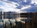 Beautiful beautiful clouds interesting sky Reflection in waterlake in forest trees landscape and joint long grass Royalty Free Stock Photo