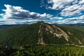 Beautiful clouds over the green mountain. Maly Yamantau Mountain in Bashkiria, Russia. A green forest under a blue sky. Forest Royalty Free Stock Photo