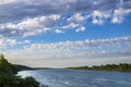 Beautiful clouds over the river on a summer day. Royalty Free Stock Photo