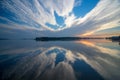 Beautiful clouds reflected on surface lake water at the sunrise