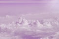 Beautiful clouds sky background with large pink sunset. Heavy purple sky from the view on a airplane, with cloudy and sunshine, a