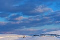 Beautiful clouds at sky over snow covered hill in cold winter sunset on Zlatibor Royalty Free Stock Photo