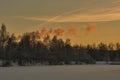 beautiful clouds of smoke and the trail of a jet plane over a frozen lake Royalty Free Stock Photo