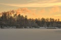 beautiful clouds of smoke and the trail of a jet plane over a frozen lake Royalty Free Stock Photo