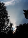 Beautiful clouds, sun ant trees.