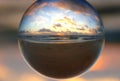 Beautiful clouds during sunrise captured through a lens ball at Fort Lauderdale Beach, Florida, U.S.A Royalty Free Stock Photo