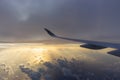 Beautiful cloudscape from airplane window, Qatar Airways. Airplane wing and aerial view of scenic morning sky. Flight concept.