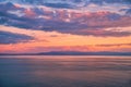 Beautiful cloudscape and dramatic sunset over mountain and sea Royalty Free Stock Photo