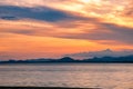 Beautiful cloudscape and dramatic sunset over mountain and sea Royalty Free Stock Photo