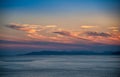 Beautiful cloudscape and dramatic sunset over mountain and sea Royalty Free Stock Photo