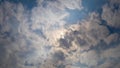 Beautiful cloudscape with large, building clouds and sunrise breaking through cloud mass