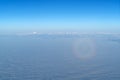 Beautiful cloudscape with magic halo from plane window