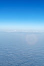 Beautiful cloudscape with magic halo from plane window