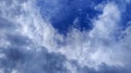 Beautiful cloudscape with soft white formations floating over a bright blue sky. Royalty Free Stock Photo