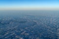 Beautiful cloudscape at sunrise from plane window Royalty Free Stock Photo