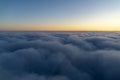 Beautiful cloudscape at sunrise from plane window Royalty Free Stock Photo