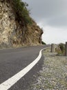 Beautiful cloudy road seen between hills