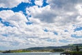 Beautiful cloudy sky above green city hill of Kiama, New South Wales, Australia.