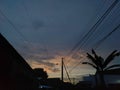 The beautiful cloudy sky behind tangle wires on power tower shot from a distance Royalty Free Stock Photo