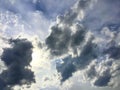 Beautiful cloudy sky. The bright sun above the cumulus clouds Royalty Free Stock Photo