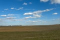 Beautiful cloudy sky over farmland. Spring landscape Royalty Free Stock Photo