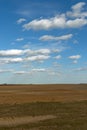 Beautiful cloudy sky over farmland. Spring landscape Royalty Free Stock Photo