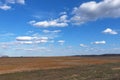 Beautiful cloudy sky over farmland. Spring landscape Royalty Free Stock Photo