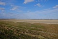 Beautiful cloudy sky over farmland. Spring landscape Royalty Free Stock Photo