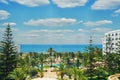 Beautiful cloudy sky over the sea in Tunisia. Summer landscape with palm trees, hotel and clouds. Holidays in Tunisia, Sousse, Royalty Free Stock Photo