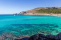 The beautiful coast shore of the island Mallorca in spain with a yacht in the clear blue water and a few swimmer