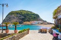 Beautiful coast of village Sant`Angelo, giant green rock in blue sea near Ischia Island, Italy Royalty Free Stock Photo