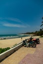 Beautiful coastal bay under a clear blue sky with parked motorcycles in BÃÂ¬nh Thuan Province, Vietnam
