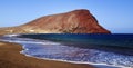 Beautiful coastal view of Playa de la Tejita with Montana Roja Red Mountain.La Tejita beach in El Medano,Tenerife. Royalty Free Stock Photo