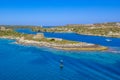 Beautiful coastline Balearis Minor with azure color of the sea and blue sky, serving peninsula with old buildings, top view, Spai Royalty Free Stock Photo