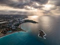 Coast with sunbeams at sunrise