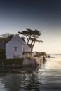 Beautiful coastline placed house reflected in the sea in sunset, Moabren, Brittany, France. Royalty Free Stock Photo