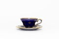 Beautiful cobalt blue colored vintage porcelain tea cup with gold ornament