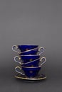 Beautiful cobalt blue colored vintage porcelain tea cups with gold ornament Royalty Free Stock Photo