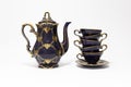 Beautiful cobalt blue colored vintage porcelain tea set with gold ornament Royalty Free Stock Photo