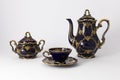 Beautiful cobalt blue colored vintage porcelain tea set with gold ornament Royalty Free Stock Photo