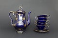 Beautiful cobalt blue colored vintage porcelain tea set with gold ornament Royalty Free Stock Photo