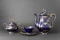 Beautiful cobalt blue colored vintage porcelain tea set with gold ornament Royalty Free Stock Photo