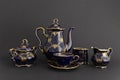 Beautiful cobalt blue colored vintage porcelain tea set with gold ornament Royalty Free Stock Photo