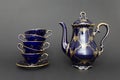 Beautiful cobalt blue colored vintage porcelain tea set with gold ornament Royalty Free Stock Photo