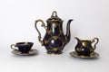 Beautiful cobalt blue colored vintage porcelain tea set with gold ornament Royalty Free Stock Photo